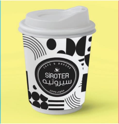 SIROTER coffee cup with stripes and dots on yellow